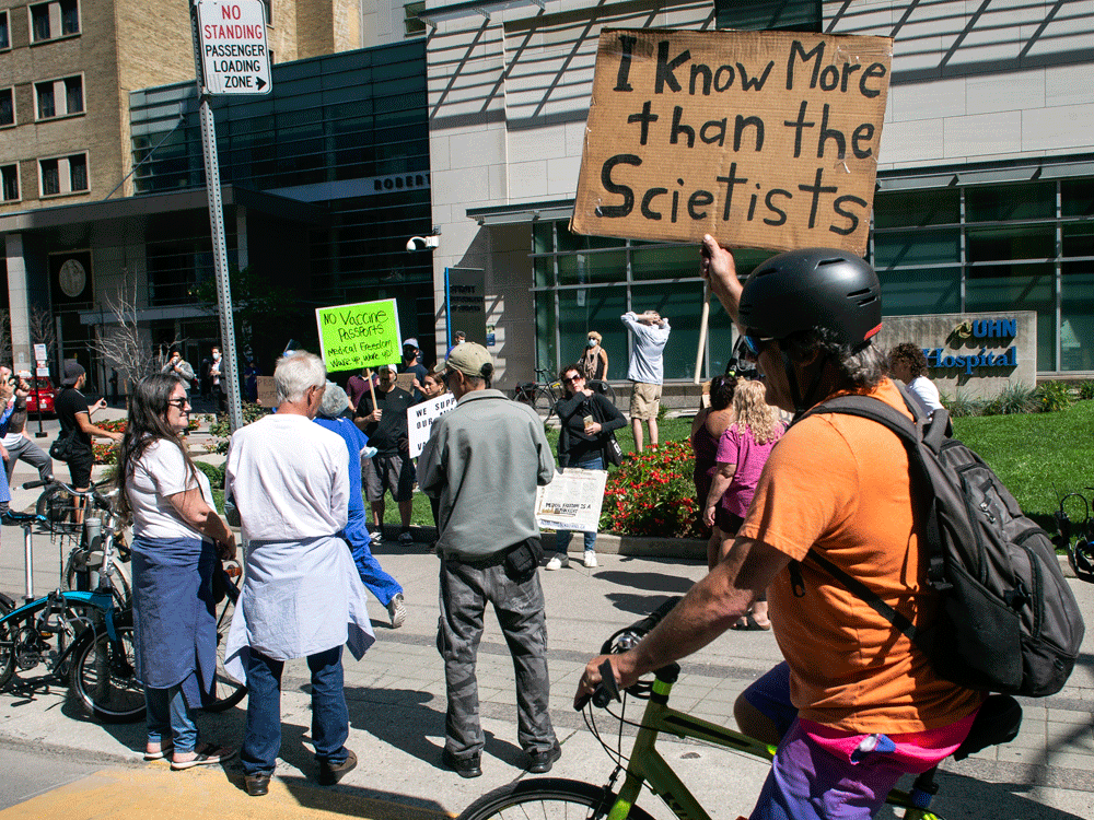  People gather outside Toronto General Hospital, on September 13, 2021, to protest against COVID-19 vaccines, vaccine passports and COVID-19 related restrictions.