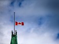 The Canadian flag flies at half-mast above the Peace Tower on Parliament Hill, on Sept. 13.