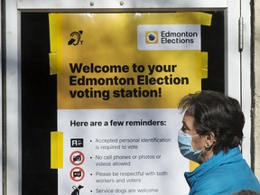 Edmontonians lineup at an advance polling station on Oct. 4, where in addition to voting for mayor, they also voted in a referendum on removing equalization from the Constitution.