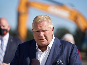 Ontario Premier Doug Ford, seen announcing funding for a new hospital in Windsor, Ont., on Oct. 18, 2021, has come under fire for off-the-cuff remarks he made about immigrants.