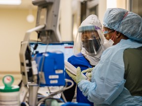 Emergency Room nurses speak to each other at the Houston Methodist The Woodlands Hospital on August 18 in Houston, Texas.