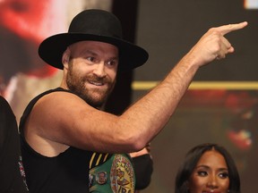 The WBC heavyweight champion taunts Wilder  during official weigh-ins at in Las Vegas. Fury will defend his title against Deontay Wilder on tonight.