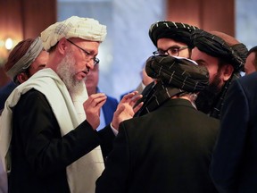 Members of the Taliban delegation, including its head Abdul Salam Hanafi, speak during international talks on Afghanistan in Moscow, Russia, October 20, 2021.