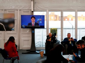 A television shows Prime Minister Justin Trudeau, during the NATO summit at the Grove hotel in Watford, northeast of London, on Dec. 4, 2019.