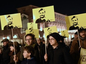 File: Activists of human rights organization Amnesty International (AI) take part in a demonstration in Piazza Castello in Turin, to mark the fourth anniversary since the disappearance of Italian student Giulio Regeni.