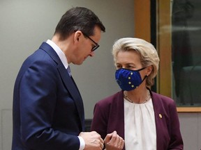 Poland's Prime Minister Mateusz Morawiecki speaks with  President of the European Commission Ursula von der Leyen at the European Union summit in Brussels on Oct. 22.
