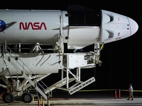 A SpaceX Falcon 9 rocket with the Crew Dragon spacecraft onboard is rolled out to the launch pad on Oct. 27, 2021 as preparations continue at Kennedy Space Center in Florida.