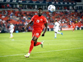 Alphonso Davies chases the ball during a 2022 World Cup Qualifying match against Panama at BMO Field in Toronto on October 13, 2021 in Toronto.