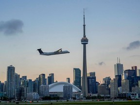 A plane takes off from Billy Bishop Airport on the Toronto waterfront on Oct. 6, 2021.