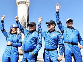 Star Trek actor William Shatner, second from left, greets the media after flying into space aboard Blue Origin’s New Shepard rocket along with Blue Origins vice-president of mission and flight operations Audrey Powers, Planet Labs co-founder Chris Boshuizen and Medidata Solutions co-founder Glen de Vries, on Oct. 13, 2021, at the landing pad near Van Horn, Texas.