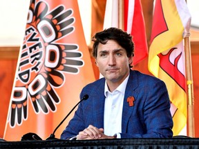 Prime Minister Justin Trudeau speaks to the press and Tk'emlups te Secwépemc community members and First Nations leaders at the Tk'emlúps Pow wow Arbour in Kamloops on Oct. 18.
