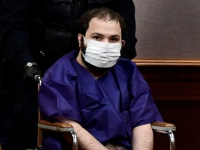 King Soopers shooting suspect Ahmad Al Aliwi Alissa, 21, appears before Boulder District Court Judge Thomas Mulvahill at the Boulder County Justice Center in Boulder on March 25.