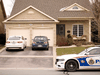 A police cruiser sits in front of the house where Andrew Chan was killed, Dec. 28, 2015 in Peterborough, Ont.