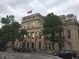 The flag is seen flying at half-mast over Canada House in London.