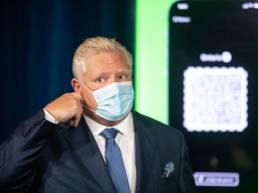 Ontario Premier Doug Ford attends a press briefing about the province's new QR code vaccine passports, on Oct. 15, 2021, in Toronto.