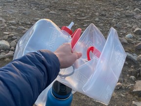 Iqaluit resident walks to a nearby river for fresh water on Wednesday.