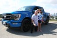 Tester Ted Pietryka and his daughter Ava are seen with the 2021 Ford F-150.