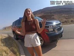 In this August 12, 2021, still image from a police bodycam released by the Moab City Police Department in Utah, Gabrielle Petito speaks with police as they responded to an altercation between Petito and her boyfriend, Brian Laundrie. (Moab City Police Department/AFP)