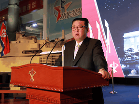 North Korea's leader Kim Jong Un speaks at the Defence Development Exhibition, in Pyongyang, North Korea, in this photo released on October 12, 2021.