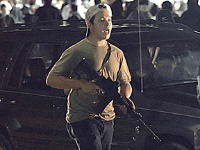 Kyle Rittenhouse, seen on the night of the shootings, has emerged as a cause celebre for many conservatives in the perennial battle over gun rights in the United States.