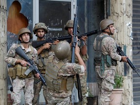 Soldiers on guard after the gunfire erupted in Beirut Thursday.