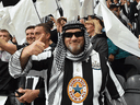 Next time leave the tea towels at home, fellas. Newcastle United fans celebrate the club's recent takeover by a Saudi-led consortium during a match between Newcastle United and Tottenham Hotspur on October 17, 2021.