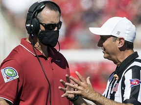 Nick Rolovich head coach of the Washington State Cougars ,talks with officials during a game on September 25, 2021 at Rice Eccles Stadium in Salt Lake City.