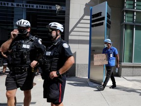 Toronto police patrol outside Toronto General Hospital during anti-vaccine mandate protests in mid-September. REUTERS/Chris Helgren