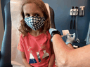 A seven-year-old girl is inoculated with a reduced dose of the Pfizer-BioNTech COVID-19 vaccine during a trial at Duke University in Durham, North Carolina on September 28, 2021.