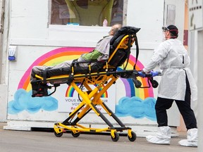 A patient is brought to the emergency department of the St. Eustache hospital in St. Eustache, Que. THE CANADIAN PRESS/Ryan Remiorz