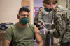 A Marine in Yuma, Ariz., receives his vaccine in February.