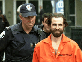 Steven Guilbeault is taken into custody by Toronto Police after environmentalists scaled the CN Tower on July 16, 2001.