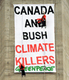 Greenpeace activists Chris Holden, top, and Steven Guilbeault hang from cables near the the top of Toronto’s CN Tower in 2001 after displaying a banner protesting the lack of action by Canada and the U.S. on environmental issues.