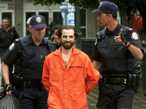 Steven Guilbeault is arrested after scaling the CN Tower in Toronto in a Greenpeace protest in July 16, 2001. Guilbeault is Canada's new environment minister.