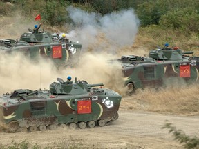 Taiwan's elite marines fire on targets from amphibious vehicles during a drill simulating a Chinese invasion, at Paolishan, Taiwan on December 24, 2008.