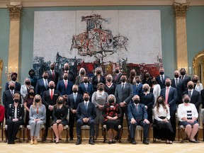 Gov. Gen. Mary May Simon sits with Prime Minister Justin Trudeau and members of the newly announced cabinet following a swearing in ceremony at Rideau Hall on Oct. 26.