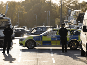Police officers at the scene of the fatal stabbing of Conservative British lawmaker David Amess at Belfairs Methodist Church in Leigh-on-Sea, a district of Southend-on-Sea, in southeast England on October 15, 2021.