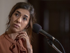 Nadia Murad, a 24-year-old Yazidi woman and co-recipient of the 2018 Nobel Peace Prize takes questions at the National Press Club on October 8, 2018 in Washington, DC. Murad is the founder of Nadia's Initiative, a foundation "supporting women and minorities through the redevelopment and stabilization of communities in crisis." (Photo by Tasos Katopodis/Getty Images)