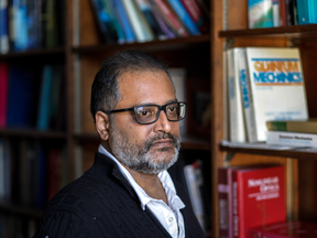 Patanjali Kambhampati in his office at McGill University in Montreal Tuesday, November 23, 2021. He has twice been turned down for federal grants because he refused to adopt hiring standards that, in his interpretation, prioritized ethnicity over merit.