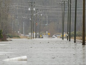 Flood water flower over a road in the Sumas area on November 18, 2021 in Abbotsford, Canada. Record rainfall this week has resulted in widespread flooding forcing residents to be evacuated from the area.