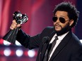 The Weeknd, shown accepting the hardware for Male Artist of the Year at the 2021 iHeartRadio Music Awards in Los Angeles this past May, has another honour to add to the list: ousting Chubby Checkers' iconic single The Twist as Billboard's No. 1 song of all time with his Blinding Lights.