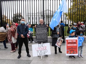 Uyghurs, Tibetans, Hongkongers and Taiwanese demonstrators protest in front of the White House in Washington, DC, on November 14, 2021, urging US President Joe Biden to support Human Rights, ahead of his virtual summit with his Chinese counterpart Xi Jinping.