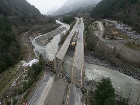 Damage caused by heavy rains and mudslides earlier in the week is pictured along the Coquihalla Highway near Hope, B.C., Thursday, November 18, 2021.