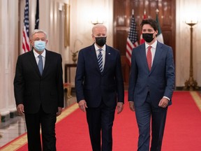 Andres Manuel Lopez Obrador, Mexico's president, from left, U.S. President Joe Biden, and Justin Trudeau, Canada's prime minister, arrive for the North American Leaders' Summit in the East Room of the White House in Washington, Nov. 18, 2021.