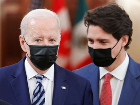 U.S. President Joe Biden and Prime Minister Justin Trudeau converse at the White House during the North American Leaders' Summit on Nov. 18, 2021.