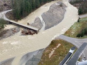 A swollen creek flows under a washed out bridge at the Carolin Mine interchange with Coquihalla Highway 5 after devastating rain storms caused flooding and landslides, near Hope, British Columbia, Canada November 17, 2021.