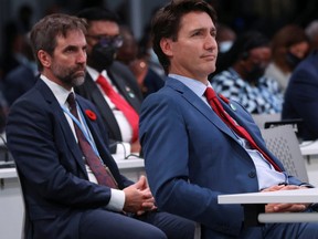 Prime Minister Justin Trudeau attends the opening ceremony of the UN Climate Change Conference COP26 at SECC on November 1, 2021 in Glasgow, United Kingdom. Steven Guilbeault, Canada's minister of environment, is seated behind him.
