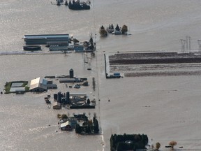 Flooded houses and farms are seen from the top of Sumas Mountain after rainstorms caused flooding and landslides in Abbotsford, British Columbia, November 17, 2021. REUTERS