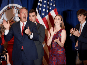 Virginia Governor-elect Glenn Youngkin, left, on stage with members of his family on election night, November 2, 2021.