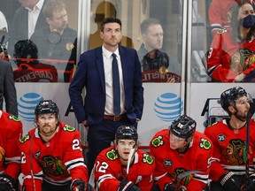 Jeremy Colliton looks on from the bench during the first period of a NHL game against the Vancouver Canucks at United Center.